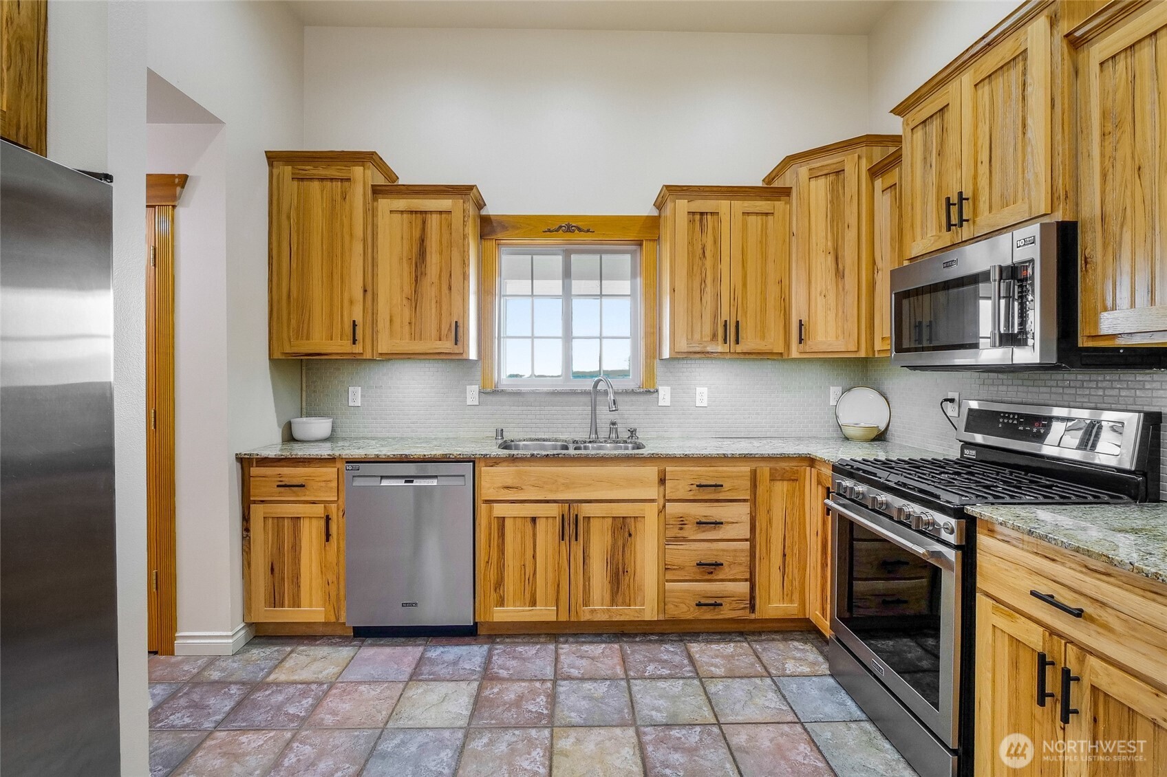 201 Vanderbilt Road Ellensburg, WA 98926 - Photo 20 of 40 a kitchen with stainless steel appliances granite countertop a stove sink microwave and cabinets