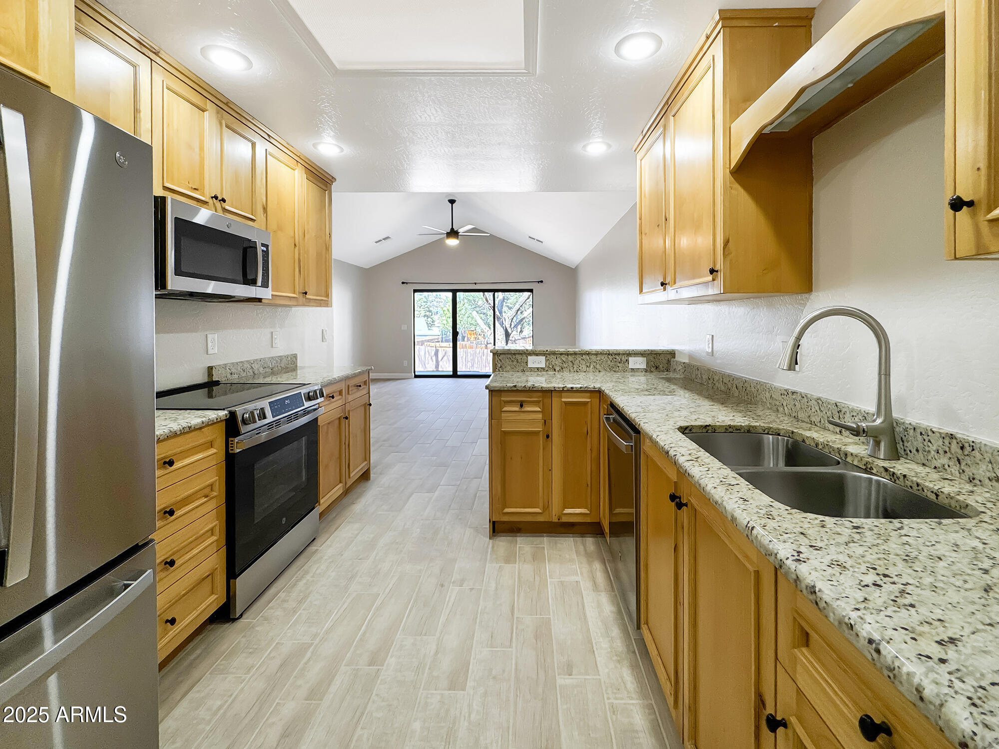 321 South Golden Bear Point Payson, AZ 85541 - Photo 2 of 23 a kitchen with stainless steel appliances granite countertop a sink a stove and a refrigerator