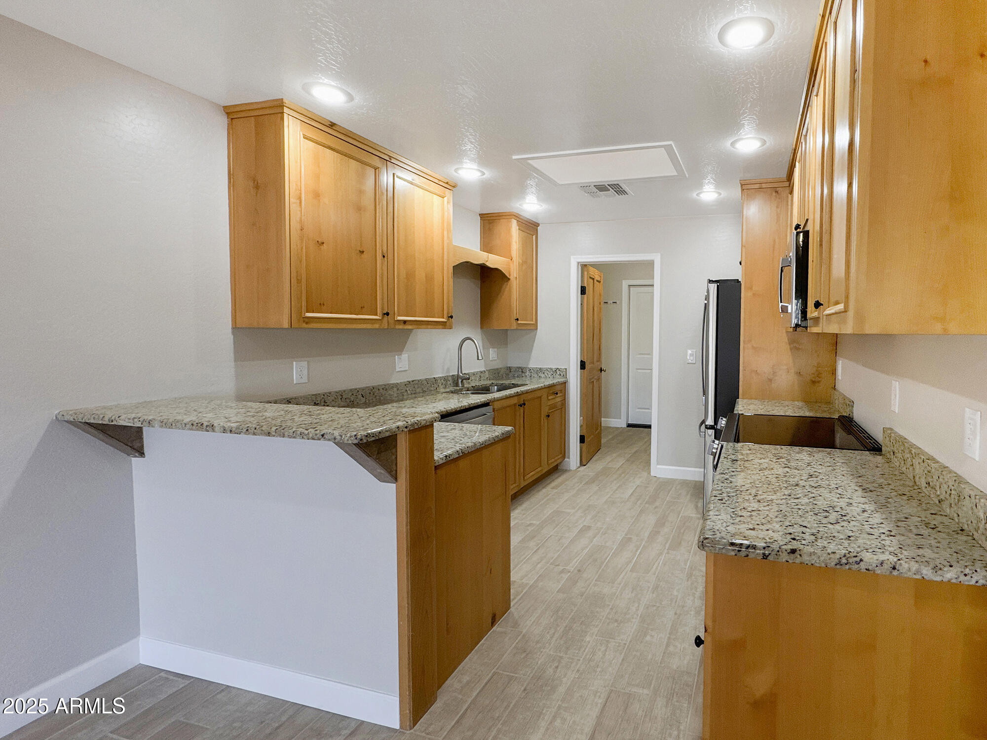 321 South Golden Bear Point Payson, AZ 85541 - Photo 5 of 23 a kitchen with kitchen island granite countertop a sink and counter space