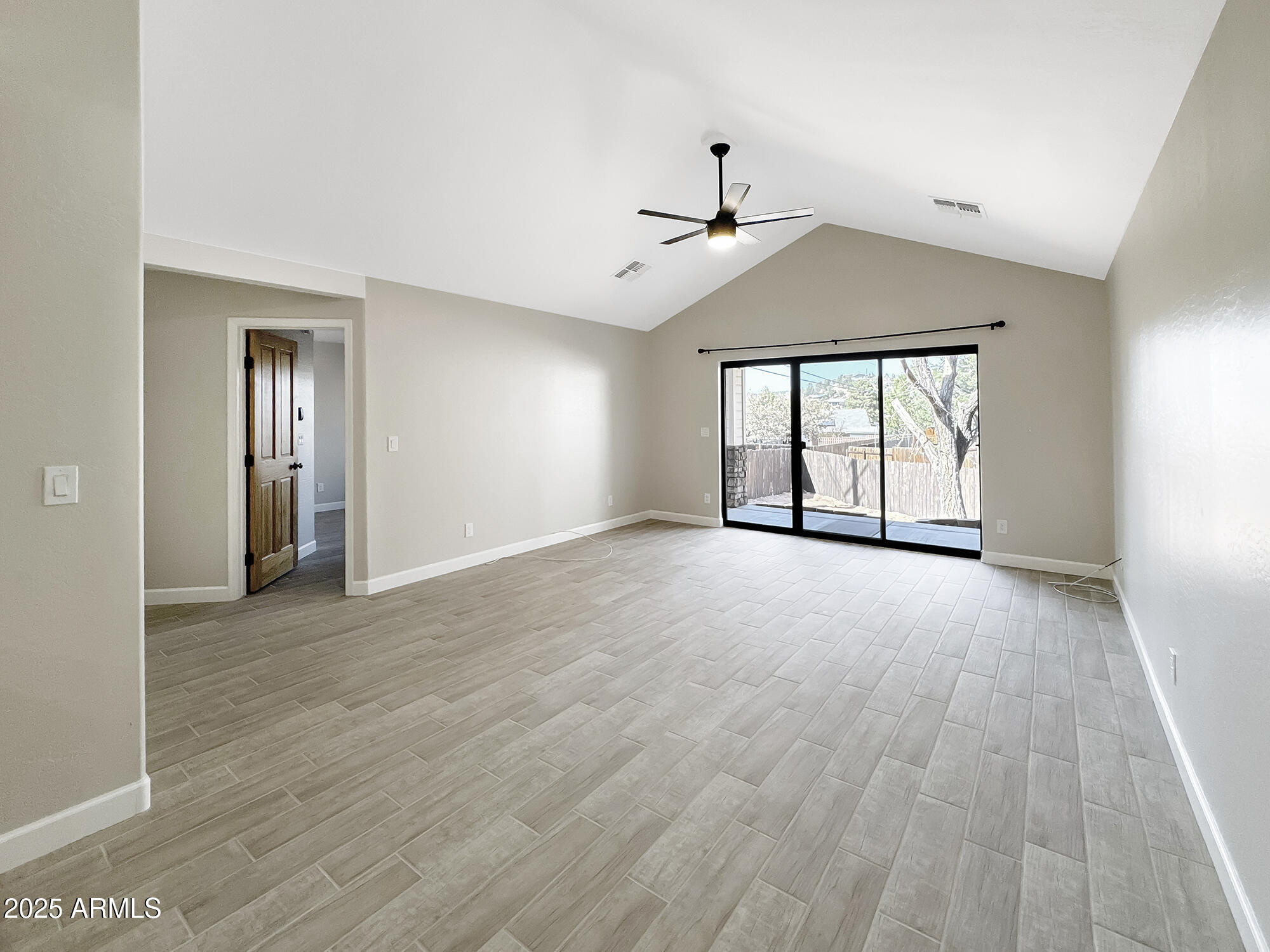 321 South Golden Bear Point Payson, AZ 85541 - Photo 9 of 23 an empty room with wooden floor chandelier and windows