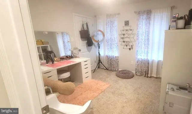 a white toilet sitting next to a shower curtain