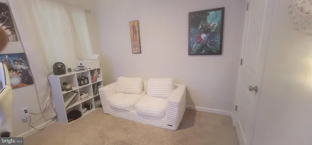 a bed room with a bed window and a chair