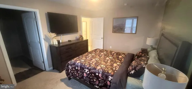 a bathroom with a double vanity sink toilet and shower