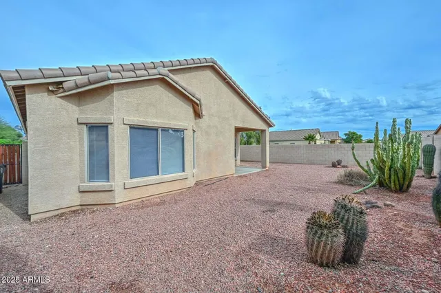 a view of a house with a yard and garage