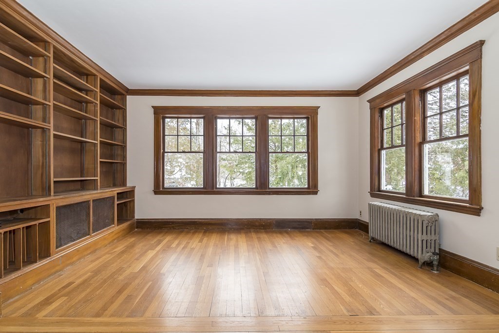 299 Weston Road Wellesley, MA 02482 - Photo 6 of 22 wooden floor in an empty room with a window