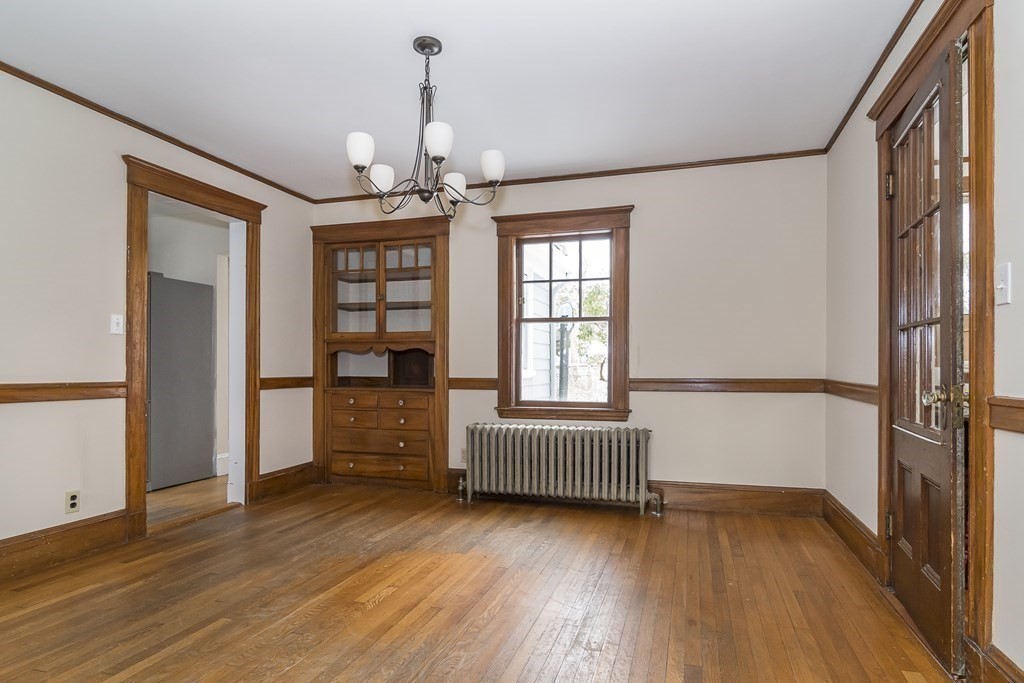 299 Weston Road Wellesley, MA 02482 - Photo 8 of 22 a view of livingroom with hardwood floor and windows