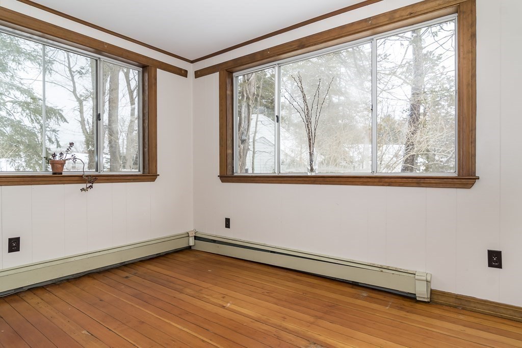 299 Weston Road Wellesley, MA 02482 - Photo 9 of 22 a view of a room with wooden floor and windows