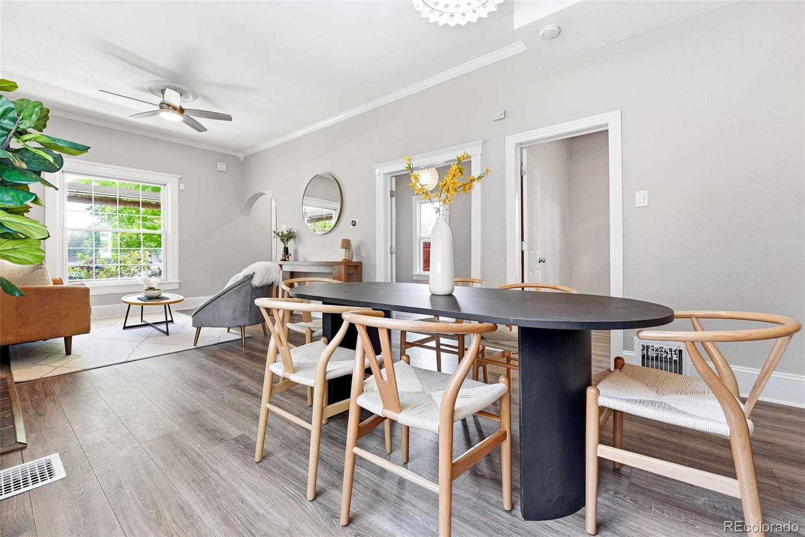 3324 Franklin Street Denver, CO 80205 - Photo 15 of 50 a view of a dining room with furniture and wooden floor