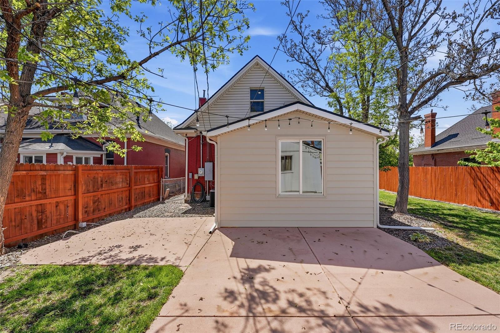 3324 Franklin Street Denver, CO 80205 - Photo 42 of 50 a front view of a house with a yard and garage