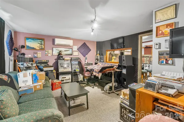 a view of a livingroom with furniture and toys