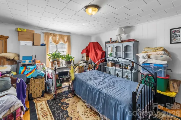 a bed room with a bed and a window