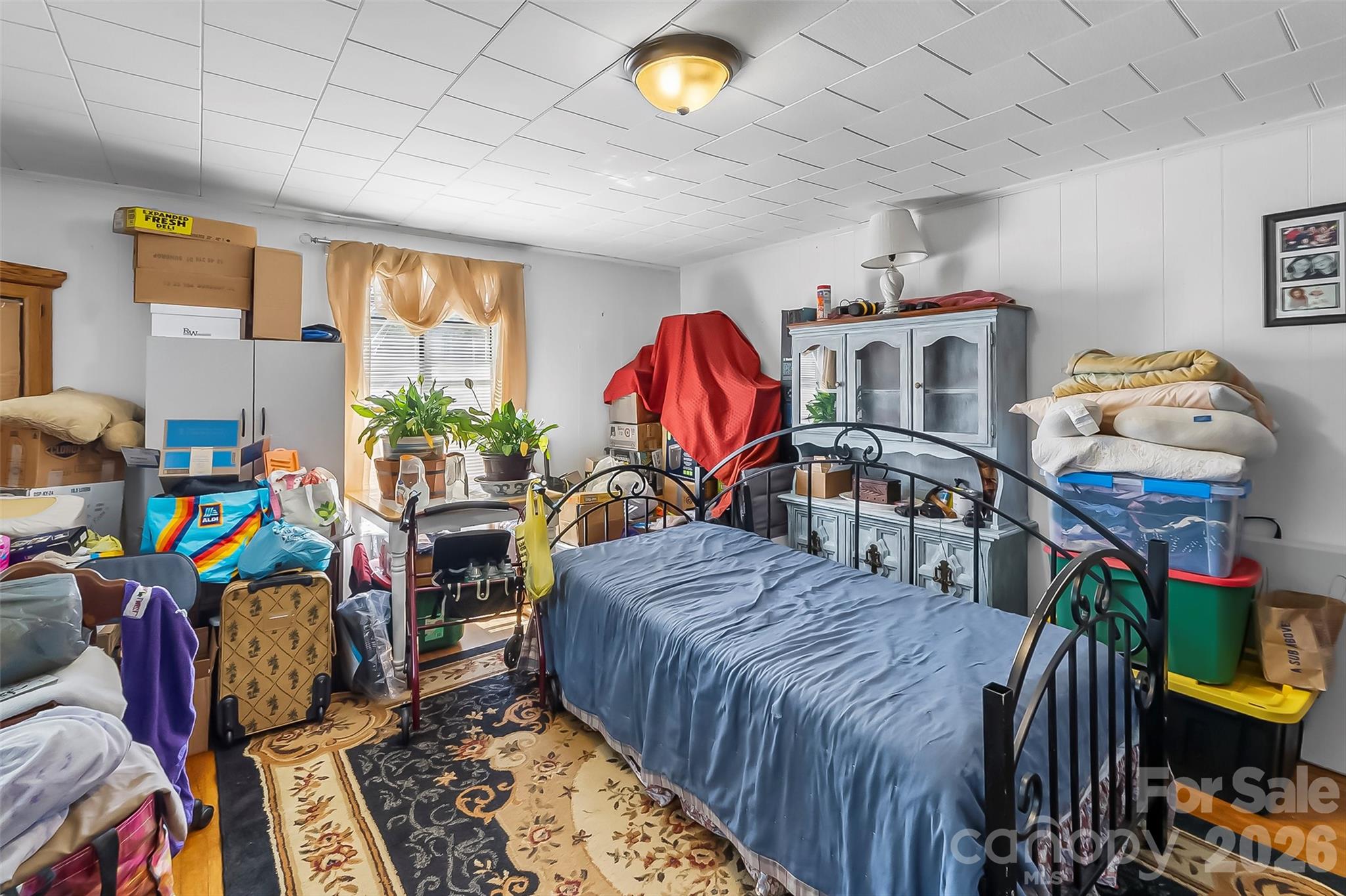 2706 Connelly Springs Road Granite Falls, NC 28630 - Photo 13 of 34 a bedroom with furniture a fireplace and a flat tv screen