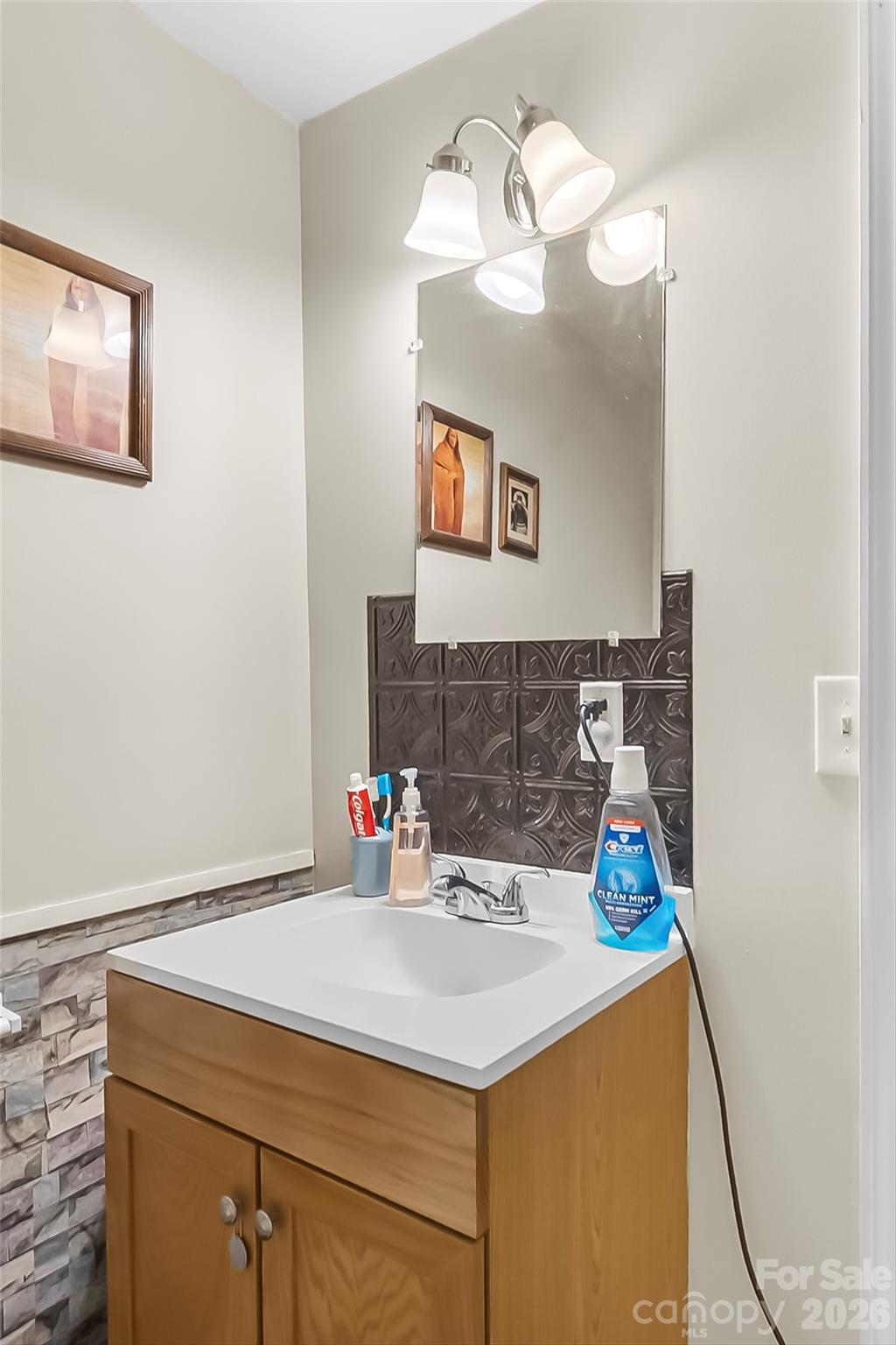 2706 Connelly Springs Road Granite Falls, NC 28630 - Photo 18 of 34 a bathroom with a sink and a mirror