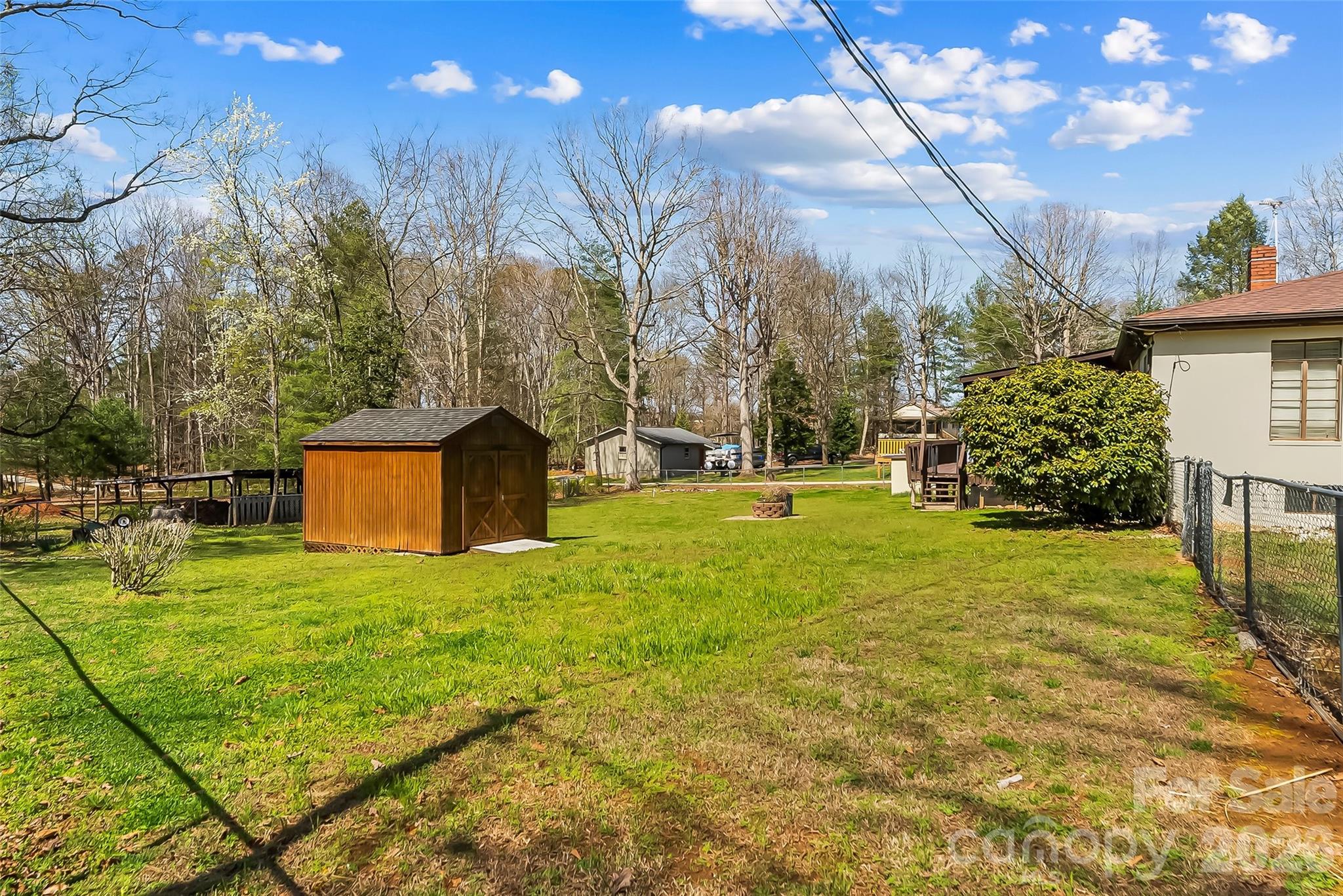 2706 Connelly Springs Road Granite Falls, NC 28630 - Photo 27 of 34 a yellow house with trees in front of it