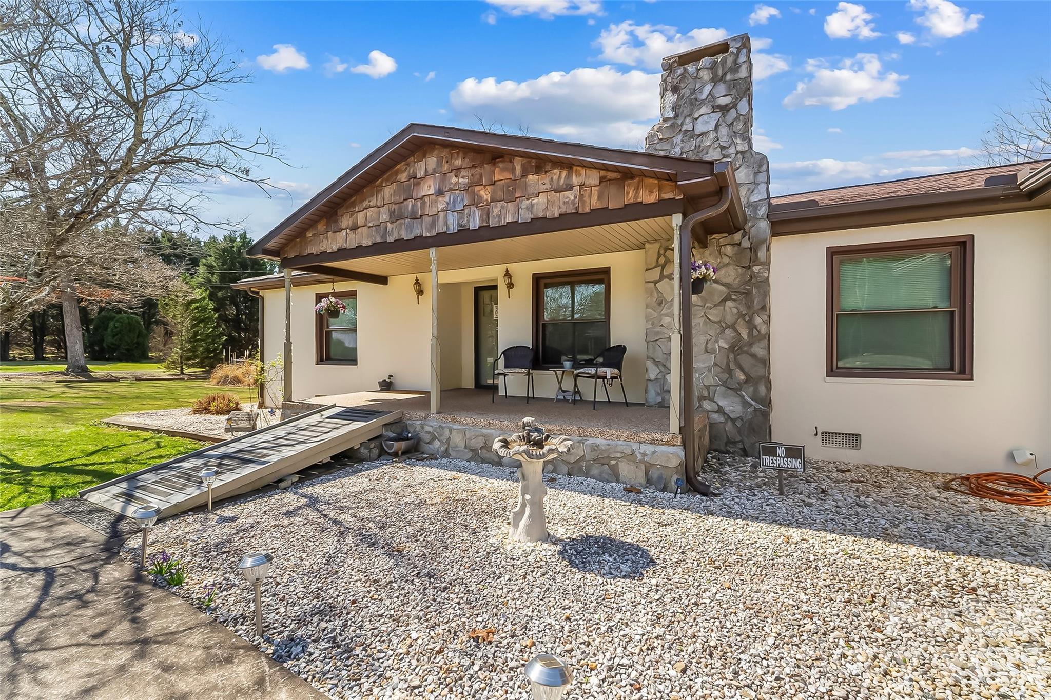 2706 Connelly Springs Road Granite Falls, NC 28630 - Photo 3 of 34 a front view of a house with a yard