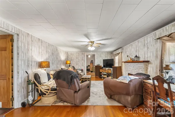 a living room with furniture and a fireplace