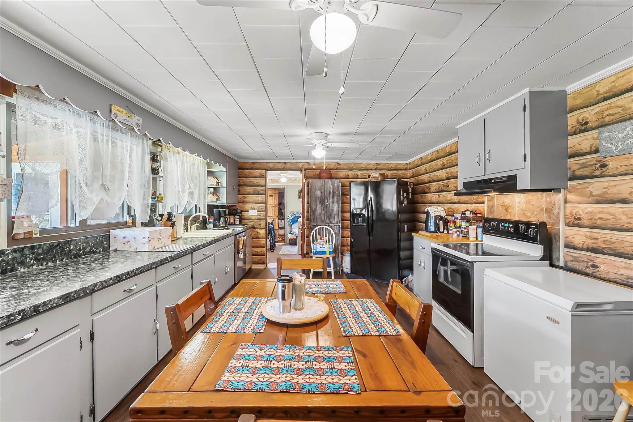2706 Connelly Springs Road Granite Falls, NC 28630 - Photo 8 of 34 a kitchen with a sink appliances and cabinets