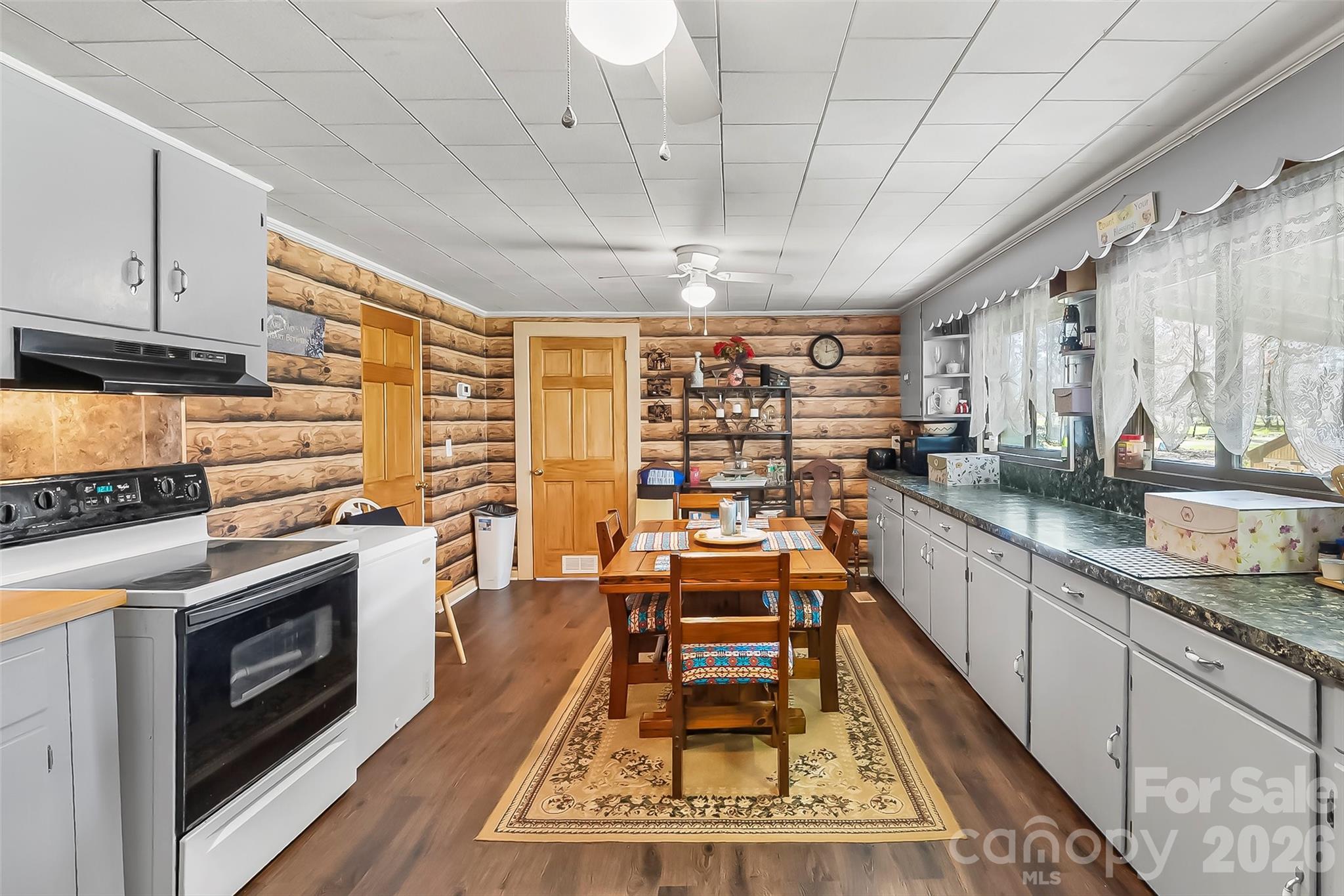 2706 Connelly Springs Road Granite Falls, NC 28630 - Photo 9 of 34 a kitchen with stainless steel appliances granite countertop a stove and a sink