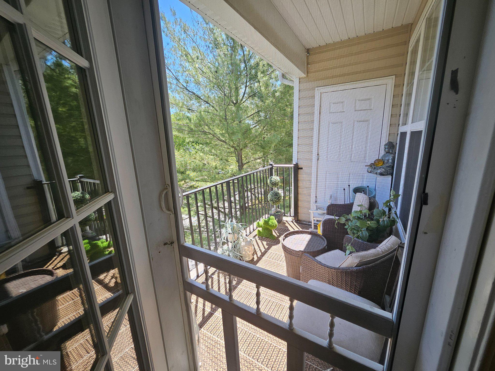 83 Kyle Way Ewing, NJ 08628 - Photo 21 of 36 Serene balcony retreat with greenery.
