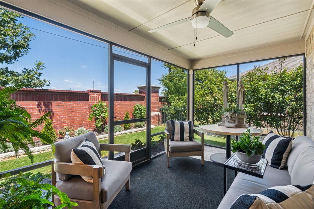 a balcony with furniture and garden view