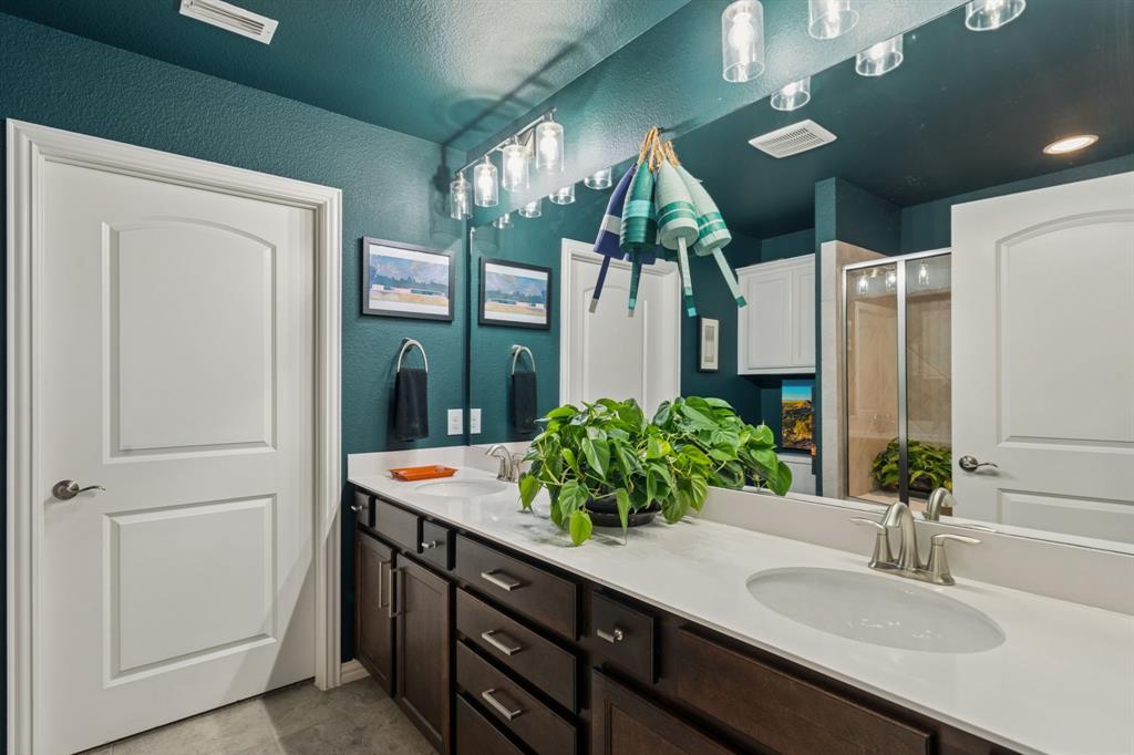 1884 Marsh Point Drive Frisco, TX 75036 - Photo 16 of 23 a bathroom with sink and mirror
