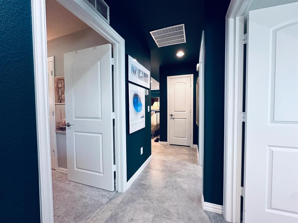 1884 Marsh Point Drive Frisco, TX 75036 - Photo 17 of 23 a view of a hallway with two rooms