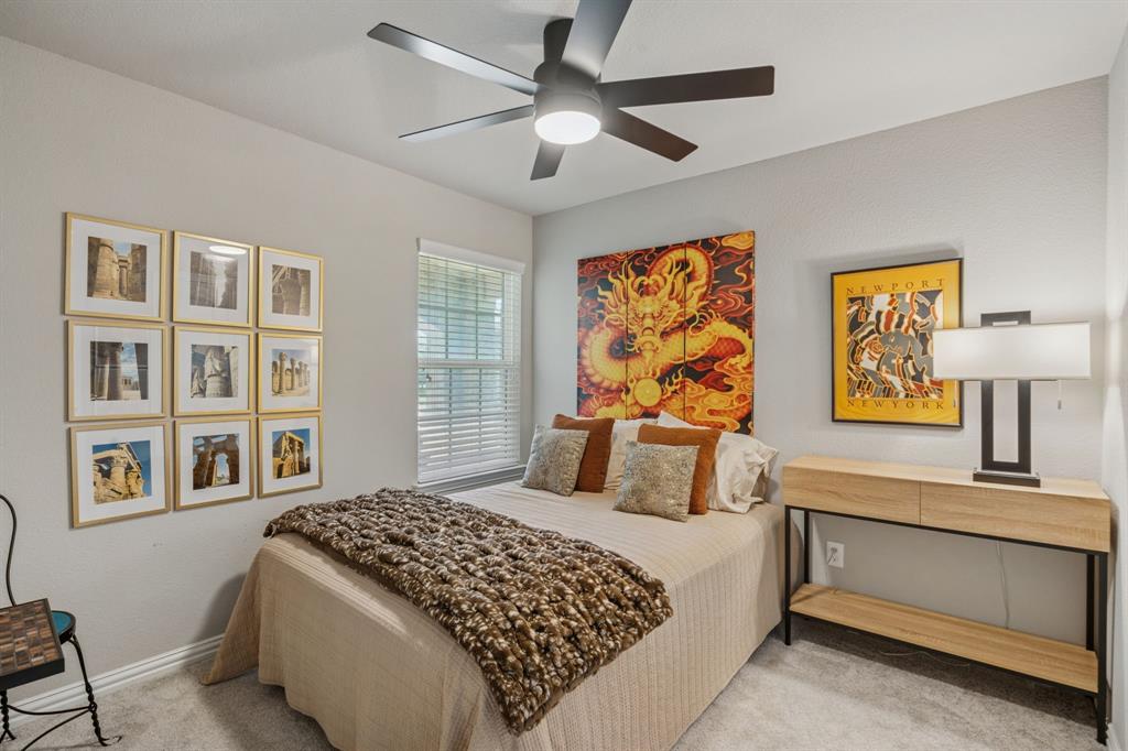 1884 Marsh Point Drive Frisco, TX 75036 - Photo 19 of 23 a bedroom with a large bed and a window