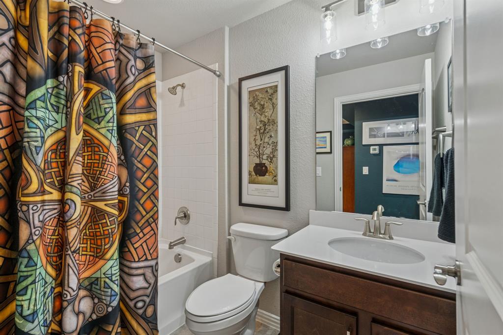 1884 Marsh Point Drive Frisco, TX 75036 - Photo 20 of 23 a bathroom with a sink a toilet and shower