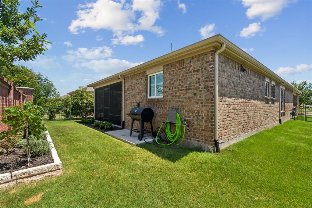 1884 Marsh Point Drive Frisco, TX 75036 - Photo 22 of 23 a front view of a house with garden