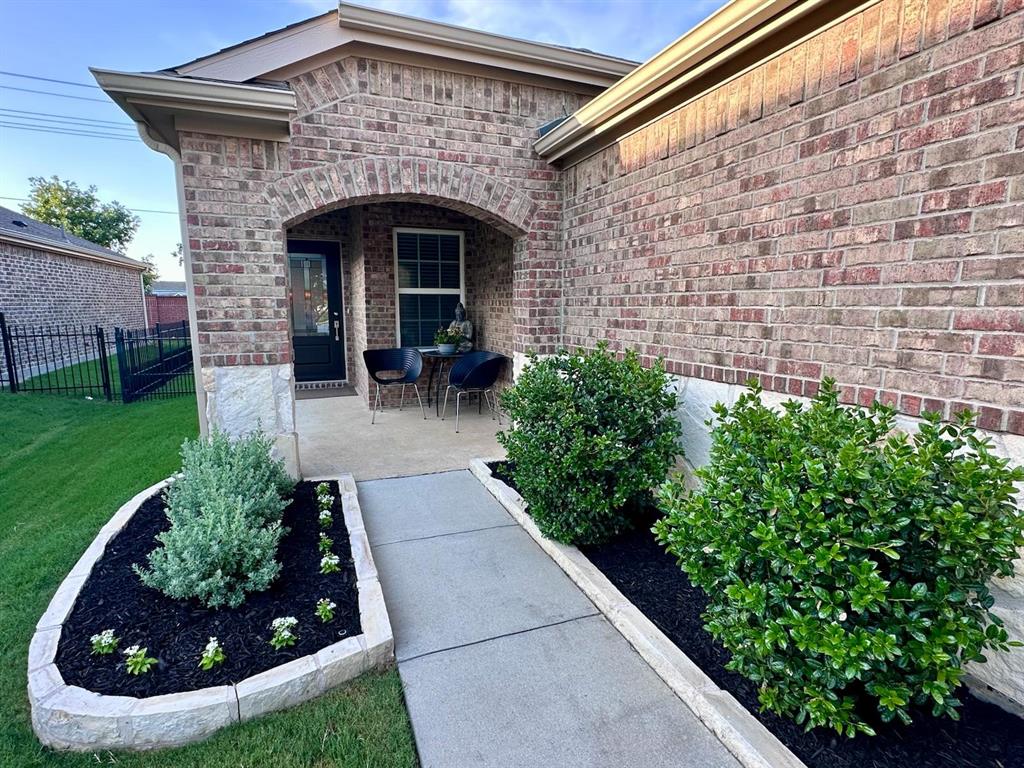 1884 Marsh Point Drive Frisco, TX 75036 - Photo 6 of 23 a front view of a house with garden