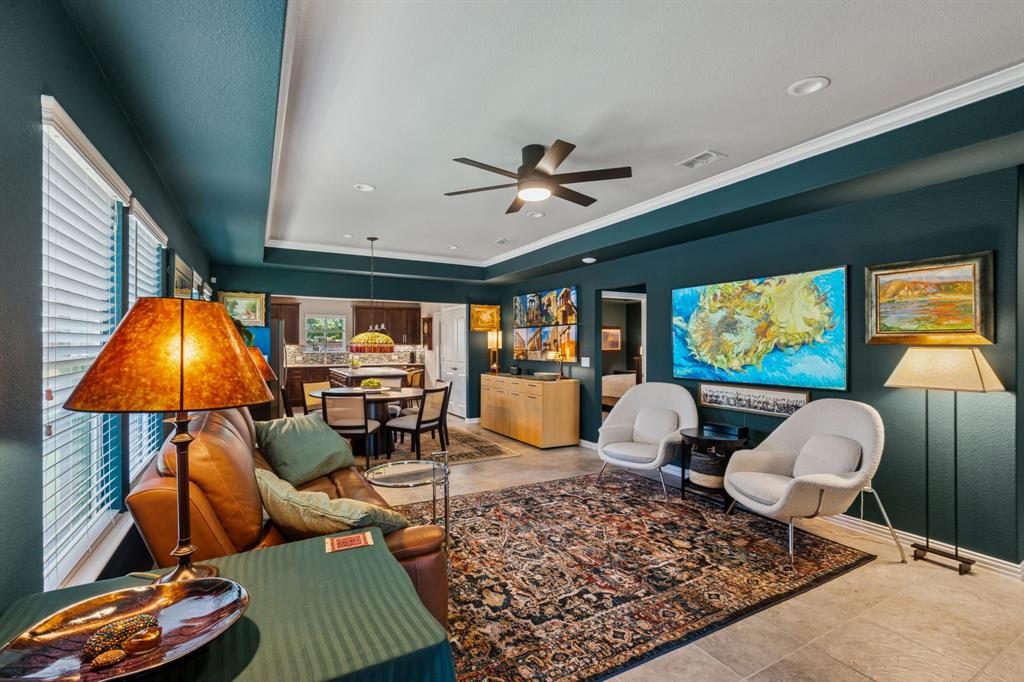 1884 Marsh Point Drive Frisco, TX 75036 - Photo 7 of 23 a living room with furniture a rug and a chandelier
