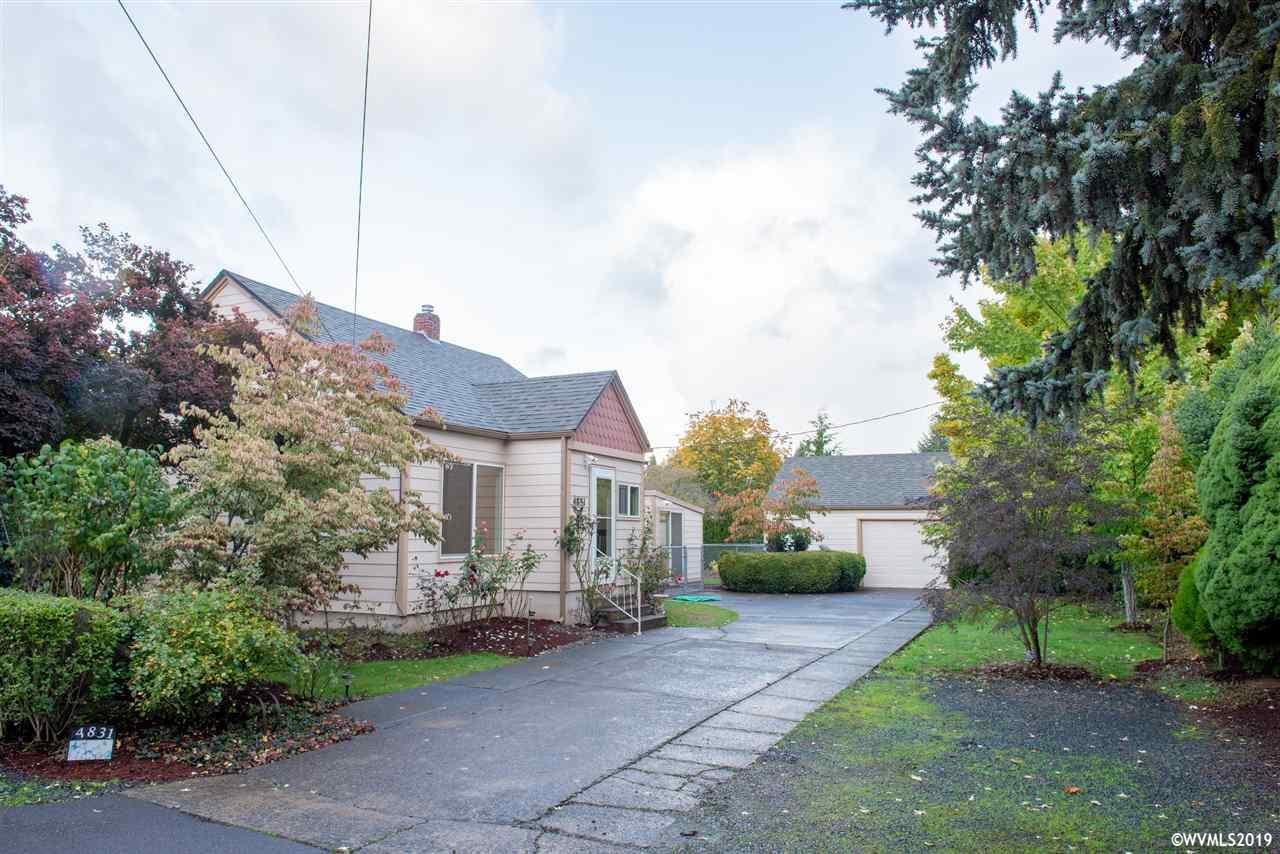 4831 Bailey Road Northeast Keizer, OR 97303 - Photo 3 of 19 a view of a white house next to a yard with potted plants