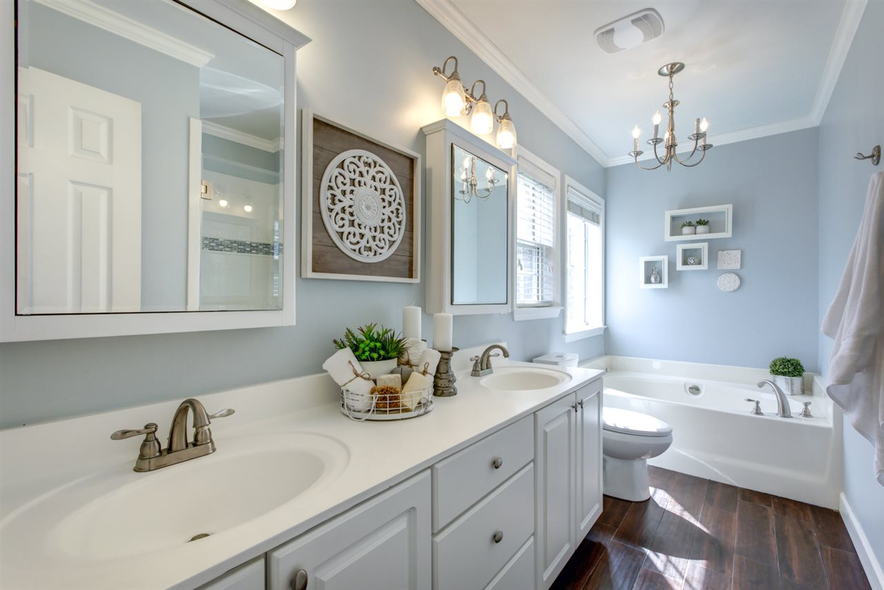 8504 Buscot Court Raleigh, NC 27615 - Photo 9 of 15 The master bath features a large GARDEN TUB, walk -in shower and dual vanities. Master Bath/Spa