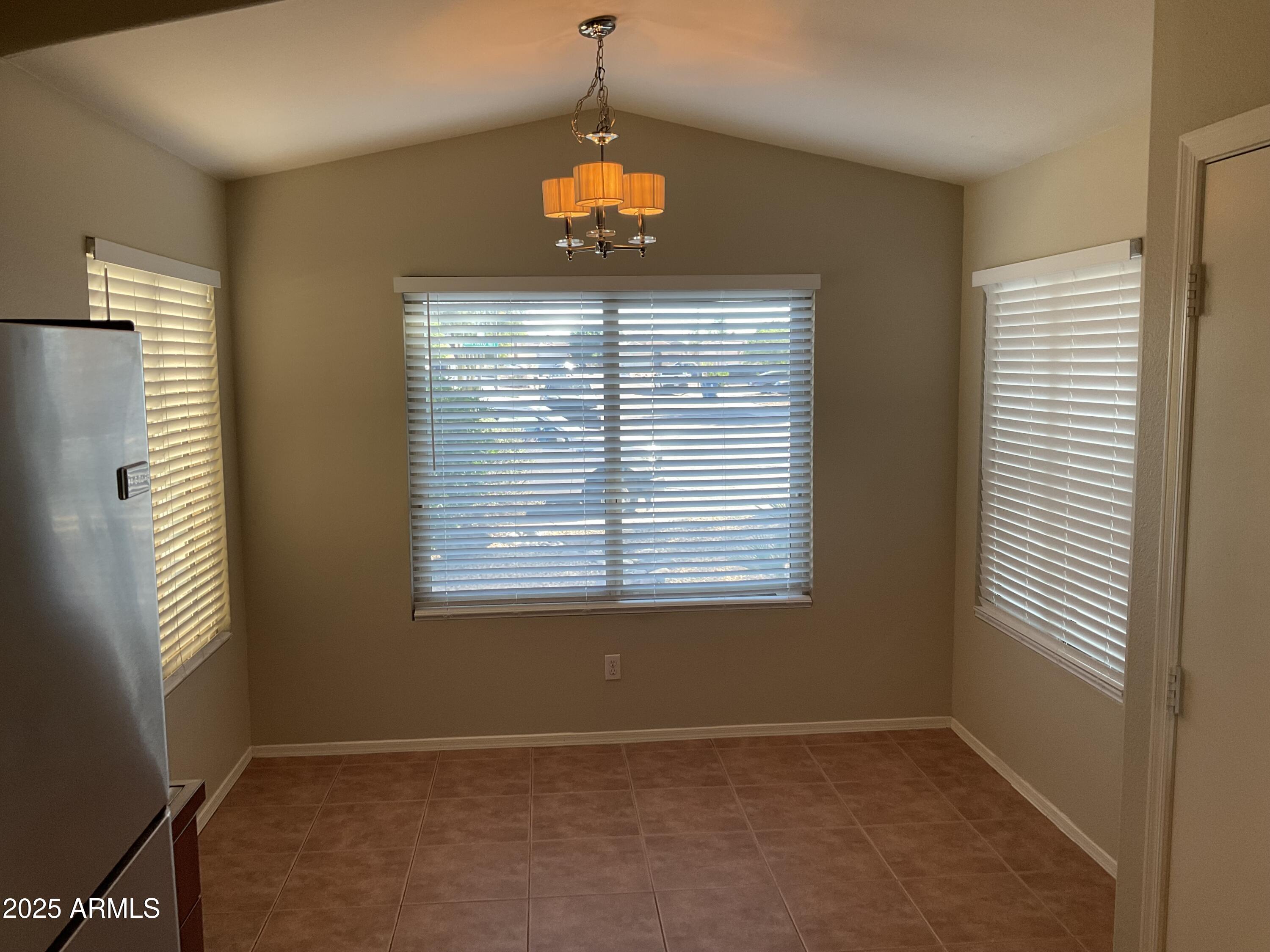 1896 South Pinto Drive Apache Junction, AZ 85120 - Photo 4 of 13 a view of an empty room with a window
