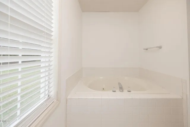 a view of a bathtub in a bathroom