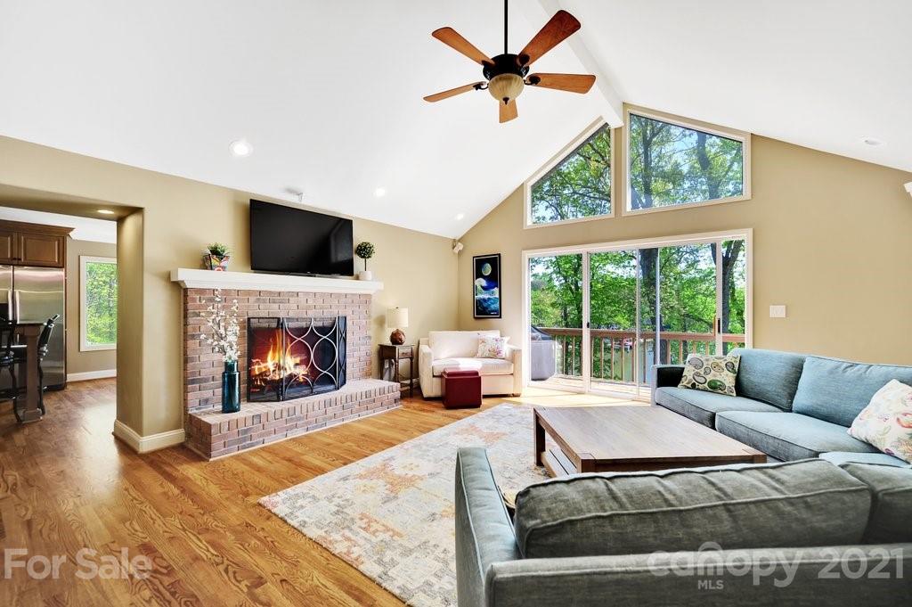 16123 Tana Tea Circle Tega Cay, SC 29708 - Photo 18 of 42 a living room with furniture fireplace and a large window