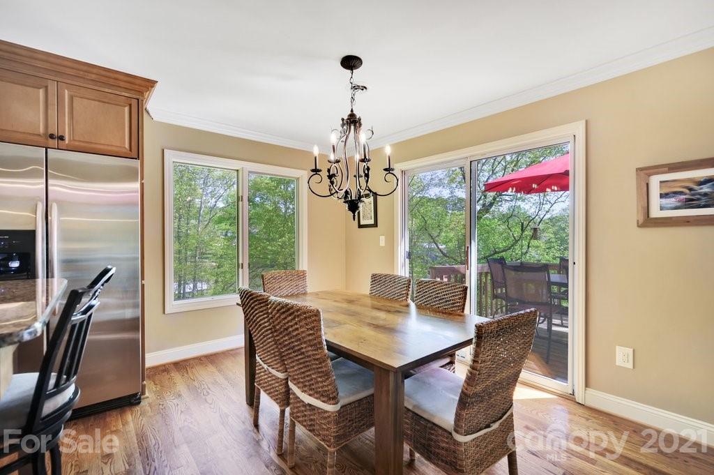 16123 Tana Tea Circle Tega Cay, SC 29708 - Photo 21 of 42 a view of a dining room with furniture window and outside view