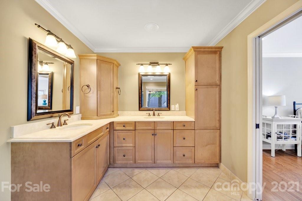 16123 Tana Tea Circle Tega Cay, SC 29708 - Photo 28 of 42 a spacious bathroom with a granite countertop sink and a mirror