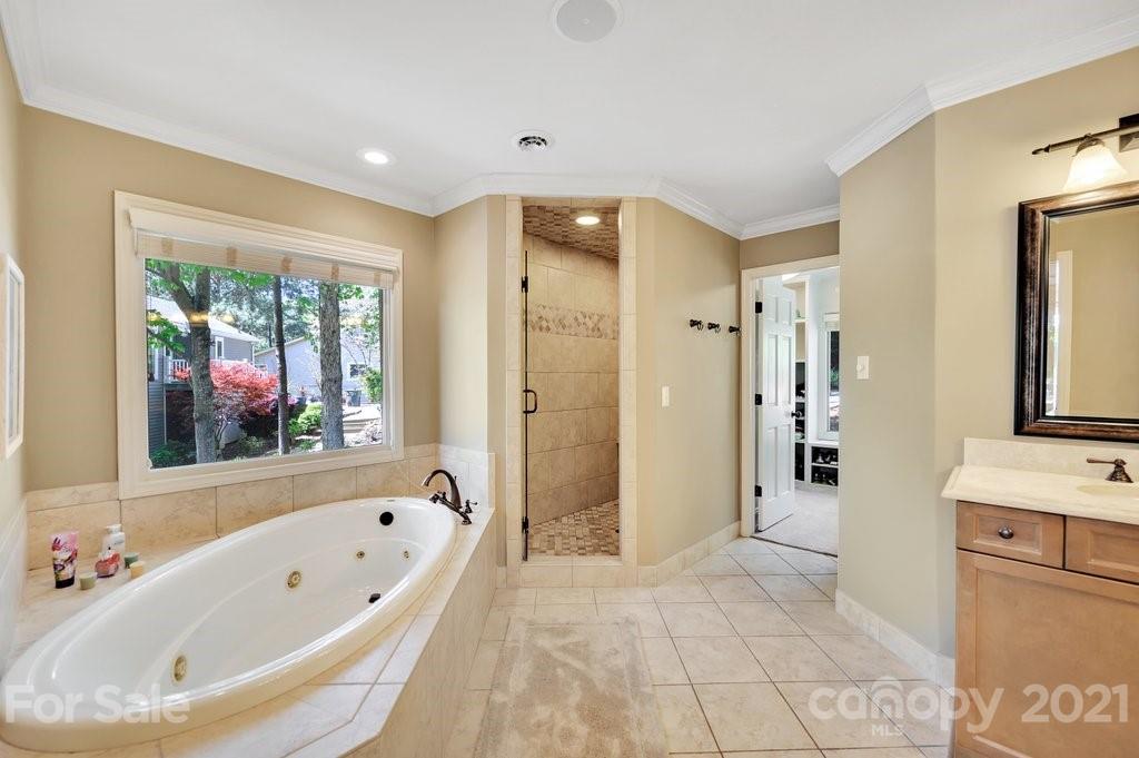 16123 Tana Tea Circle Tega Cay, SC 29708 - Photo 30 of 42 a bathroom with a bathtub and a shower