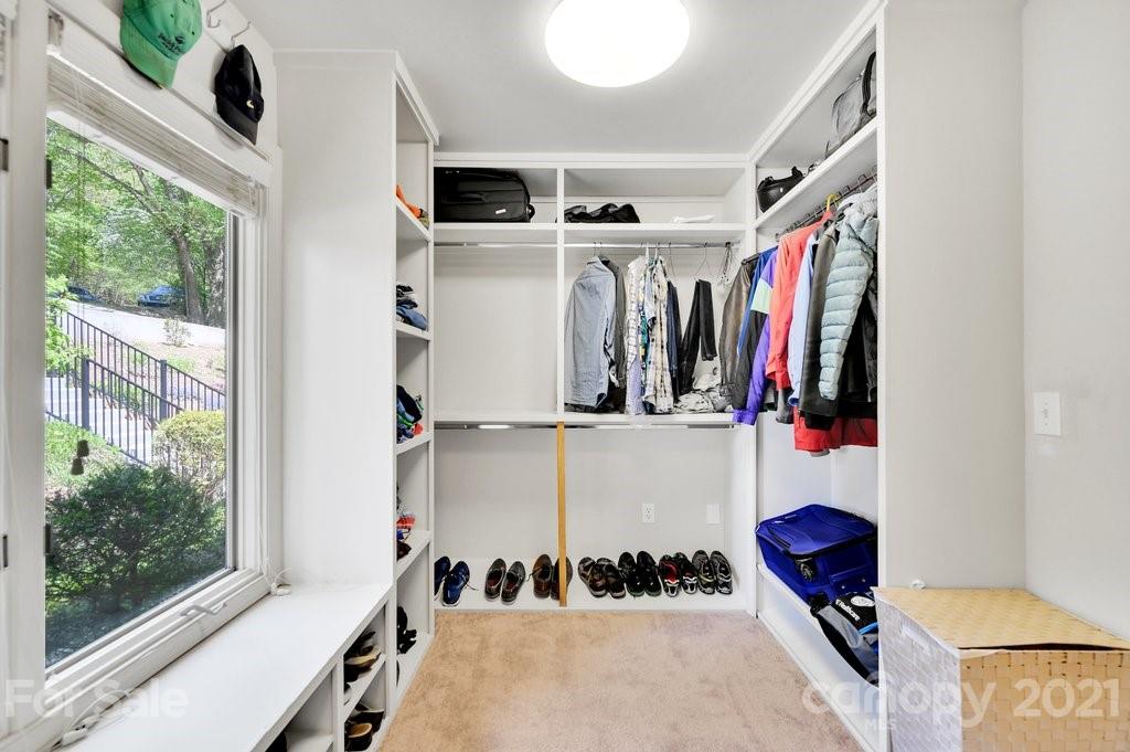 16123 Tana Tea Circle Tega Cay, SC 29708 - Photo 32 of 42 a view of walk in closet with clothes and shoes