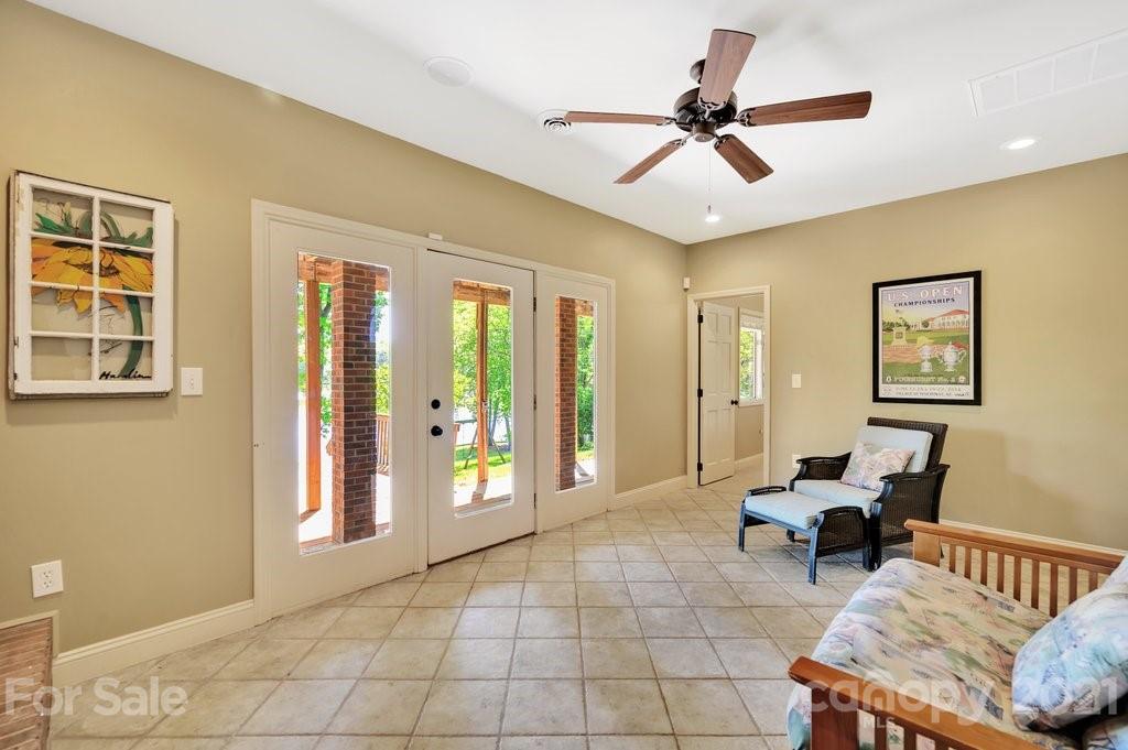 16123 Tana Tea Circle Tega Cay, SC 29708 - Photo 36 of 42 a living room with furniture and two windows