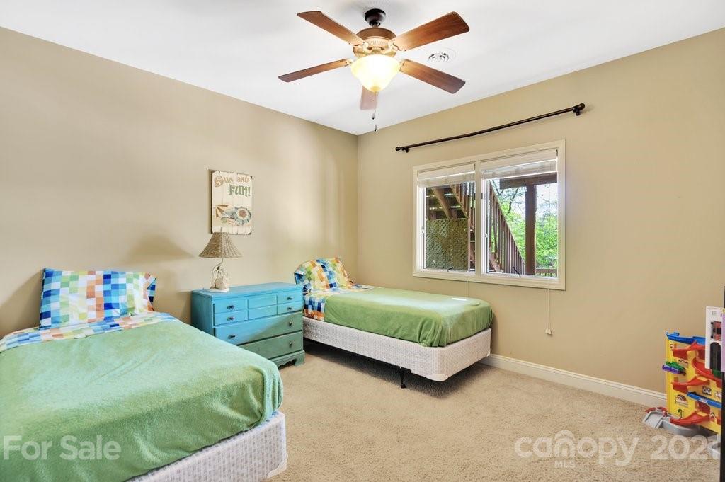 16123 Tana Tea Circle Tega Cay, SC 29708 - Photo 38 of 42 a bedroom with two beds and a window