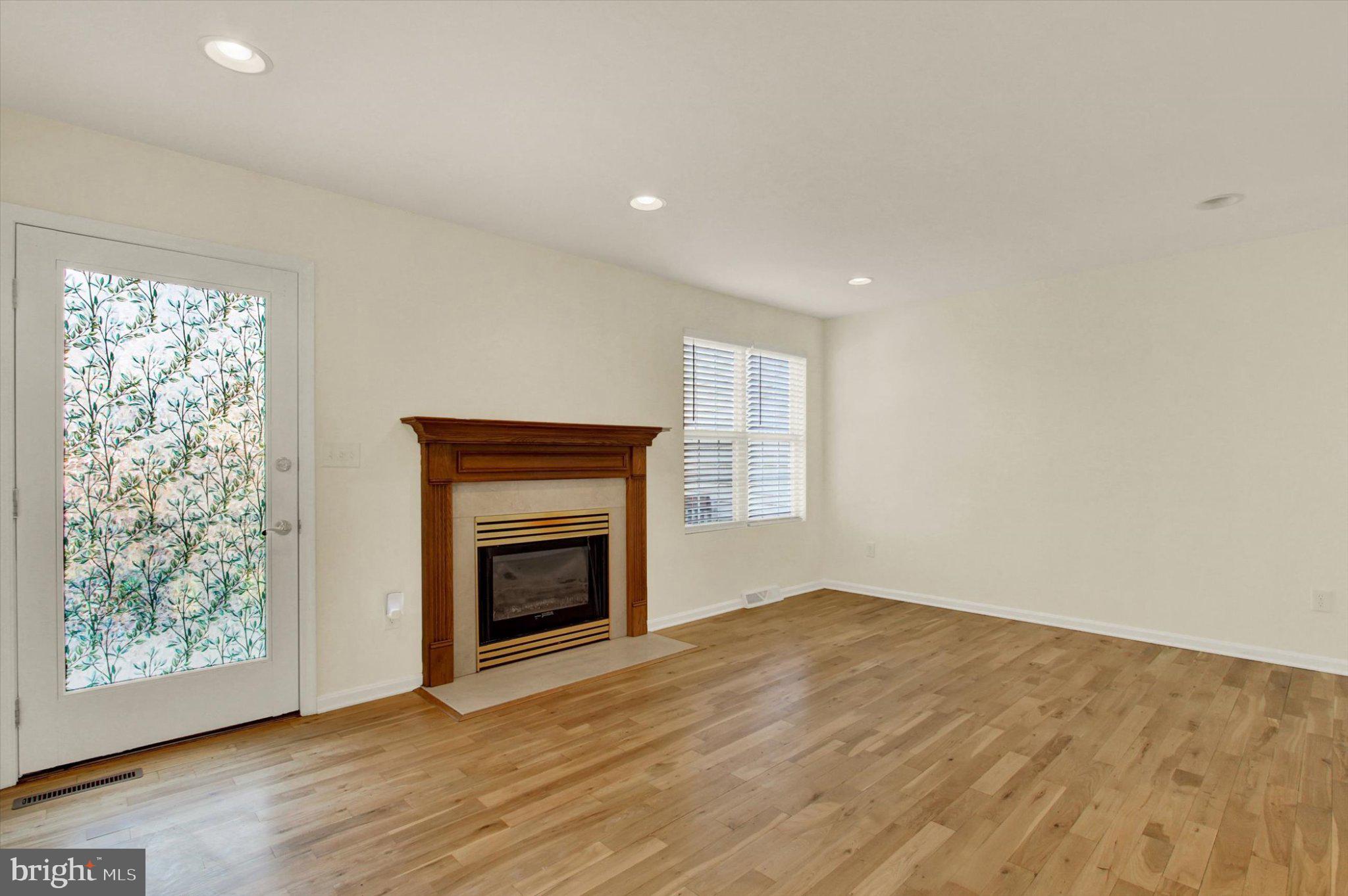 170 Morningstar Court Hanover, PA 17331 - Photo 15 of 32 an empty room with windows and a fireplace