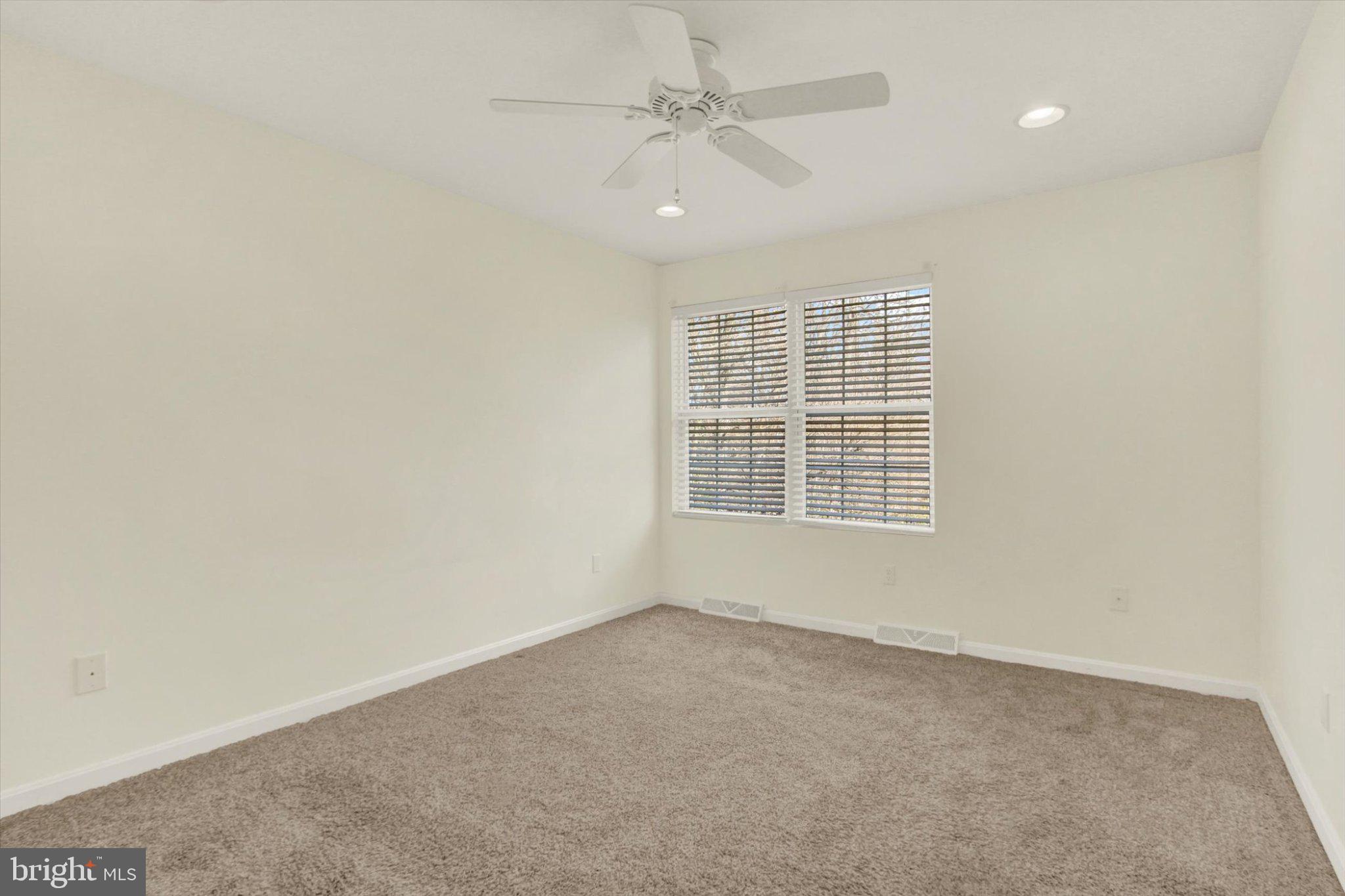 170 Morningstar Court Hanover, PA 17331 - Photo 18 of 32 an empty room with windows and fan