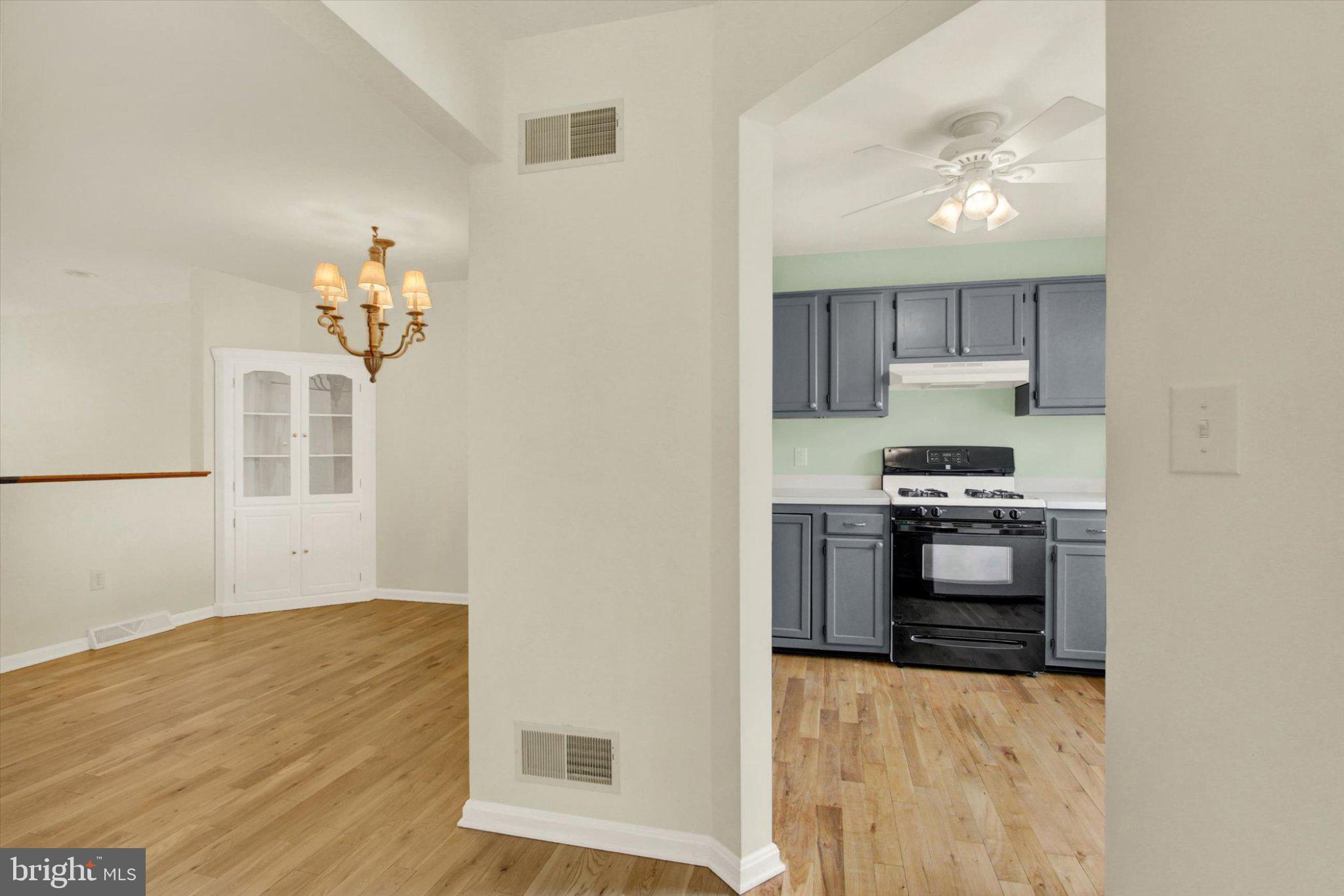 170 Morningstar Court Hanover, PA 17331 - Photo 5 of 32 a kitchen with stainless steel appliances a stove a microwave and cabinets