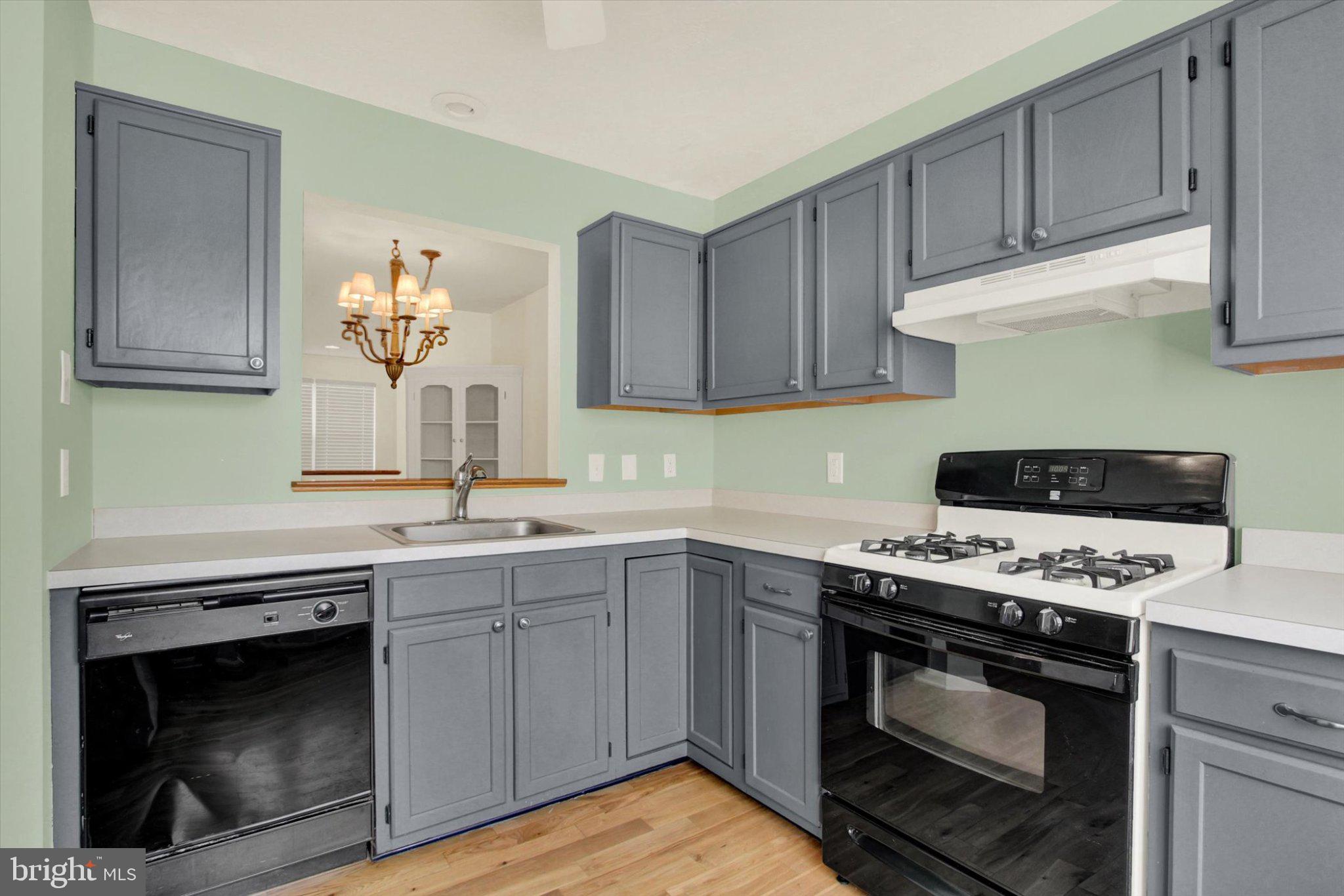 170 Morningstar Court Hanover, PA 17331 - Photo 8 of 32 a kitchen with stainless steel appliances a stove a sink and a microwave