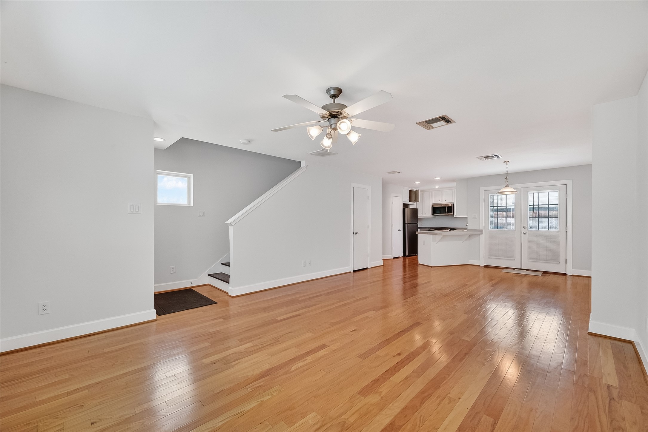 5951 S Loop East, Unit 47 Houston, TX 77033 - Photo 6 of 37 This living space has a bright, open-plan living area with hardwood floors. Plenty of space for a dining table and large living area.