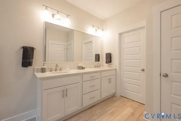 a white bath tub sitting next to a shower