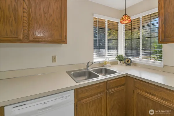 a kitchen with a sink and cabinets