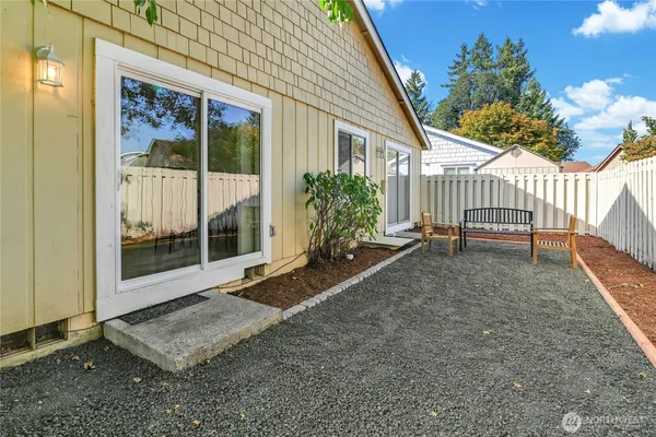 a view of a house with a backyard and porch